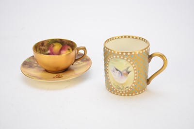 Lot 452 - Royal Worcester fruit-decorated cabinet cup and saucer and a Ken Russell coffee can