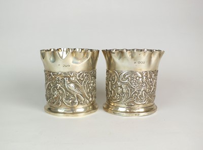 Lot 38 - A pair of Victorian silver coasters by William Comyns