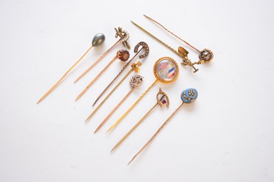 Lot 192 - A collection of eleven stick pins