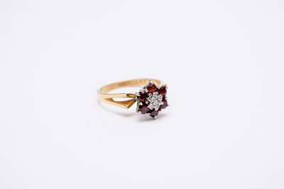 Lot 200 - A garnet and diamond floral cluster ring