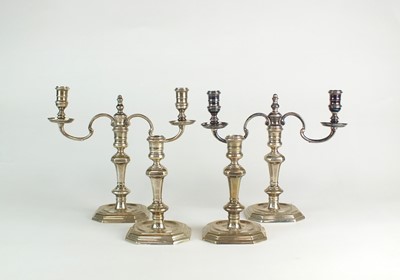 Lot 41 - A set of four silver candlesticks