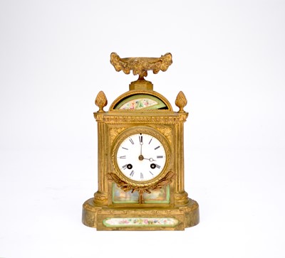 Lot 612 - A French gilt-metal mantel clock