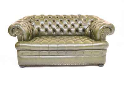 Lot 694 - A leather Chesterfield two-seater sofa