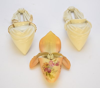 Lot 227 - Two Royal Worcester amphora and one orchid wall pockets