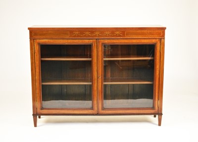 Lot 557 - An Edwardian inlaid mahogany glazed bookcase