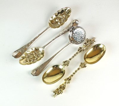 Lot 61 - A pair of Victorian silver gilt figural spoons, two silver tablespoons and a sugar sifter spoon