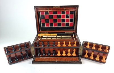 Lot 311 - A Victorian walnut and rosewood games compendium