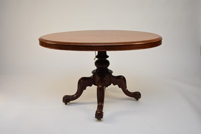 Lot 698 - A Victorian walnut oval tilt-top occasional table