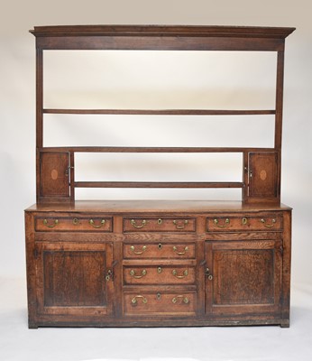 Lot 513 - An 18th century Welsh cross-banded oak dresser and rack