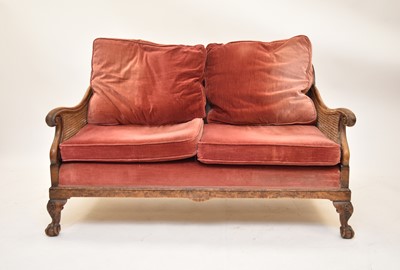 Lot 536 - An Edwardian walnut bergere suite, with a further similar chair