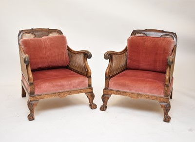 Lot 536 - An Edwardian walnut bergere suite, with a further similar chair