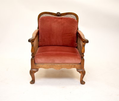Lot 536 - An Edwardian walnut bergere suite, with a further similar chair
