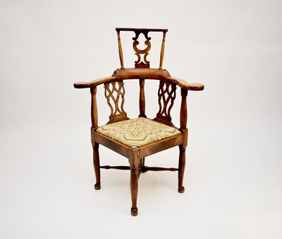 Lot 643 - A 19th century, 18th century style, fruitwood corner chair