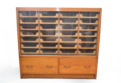 Lot 745 - A post-war oak haberdasher’s cabinet