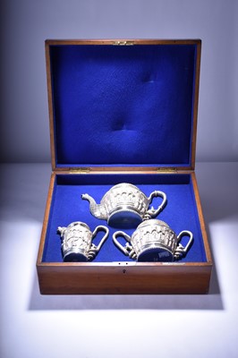 Lot 128 - A cased Anglo-Indian silver three-piece tea set by Peter Orr & Sons