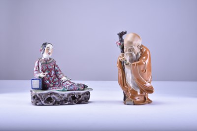 Lot 40 - A Chinese famille rose figure of a maiden and a Shiwan figure of Shoulao