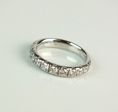 Lot 98 - A platinum diamond half hoop eternity ring