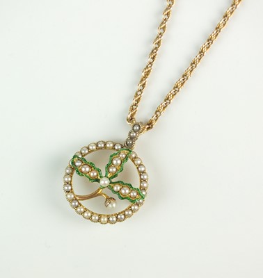 Lot 88 - An early 20th century seed pearl and green enamel brooch/pendant on chain