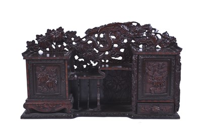 Lot 112 - A Japanese carved wood wall hanging cabinet
