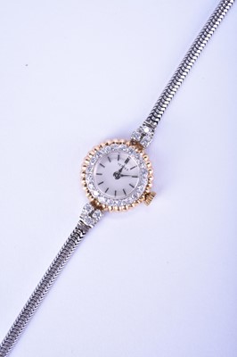 Lot 129 - Vertex: A lady's diamond-set bi-metal watch on a 9ct white gold bracelet