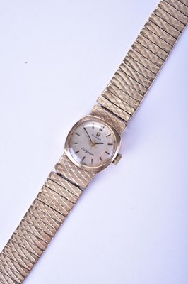 Lot 141 - Omega: A 9ct gold Ladymatic bracelet watch