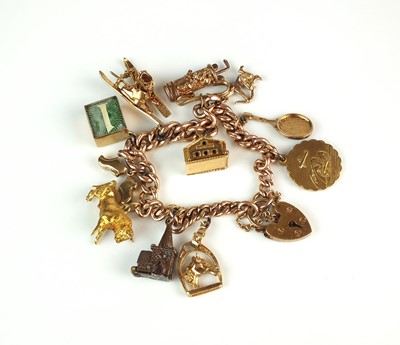 Lot 80 - A 9ct rose gold graduated curb link bracelet with attached yellow metal and gold charms