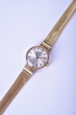 Lot 142 - Omega: A lady's 9ct gold bracelet watch with 18ct bracelet and further 9ct bracelet