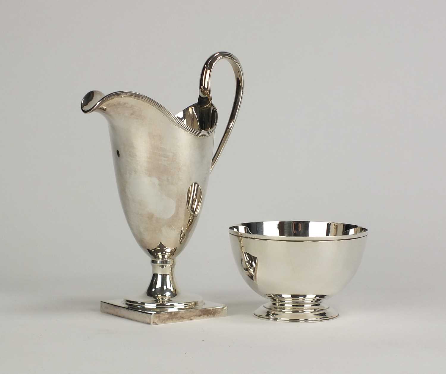 Lot 3 - A silver cream jug and a sugar bowl