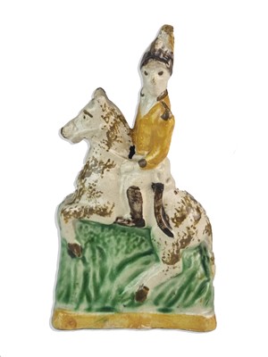 Lot 252 - Prattware figure of a cavalryman on horseback