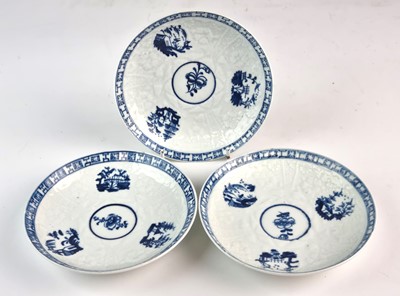 Lot 250 - Three Lowestoft blue and white saucers, circa 1764-66