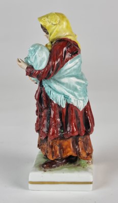 Lot 273 - German porcelain figure of Russian peasant woman with baby, 19th century