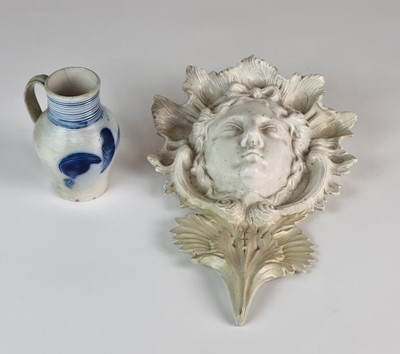 Lot 219 - Staffordshire salt-glaze wall pocket and 'scratch-blue' jug