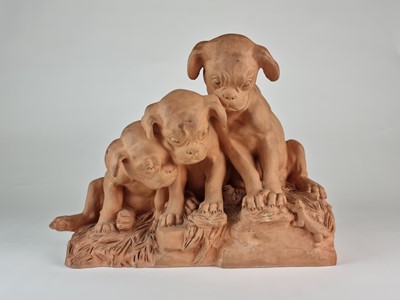 Lot 267 - French terracotta group of three pug dog puppies looking at lizard, after Georges Lucien Vacossin