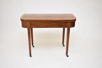 Lot 534 - A George III inlaid mahogany fold-over tea table