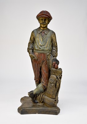 Lot 466 - A recent cast and painted terracotta garden/conservatory figure of a golfer