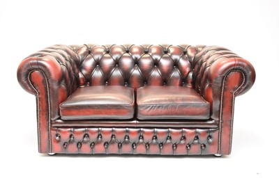 Lot 582 - A leather Chesterfield two-seater sofa