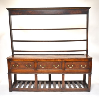 Lot 518 - A George III oak dresser and rack