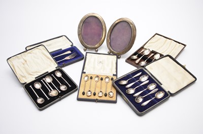 Lot 34 - A collection of silver cutlery and two silver mounted frames