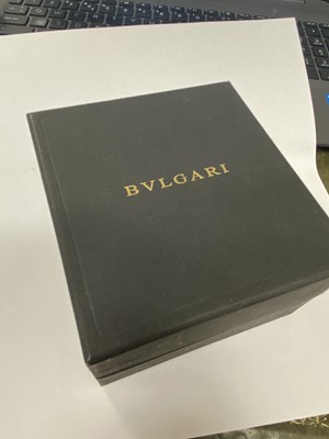 Lot 94 - A yellow metal and stainless steel Bvlgari hinged bangle