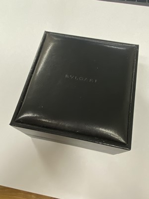 Lot 94 - A yellow metal and stainless steel Bvlgari hinged bangle