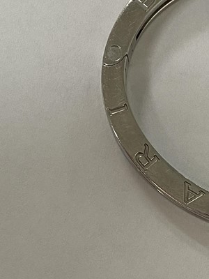 Lot 94 - A yellow metal and stainless steel Bvlgari hinged bangle