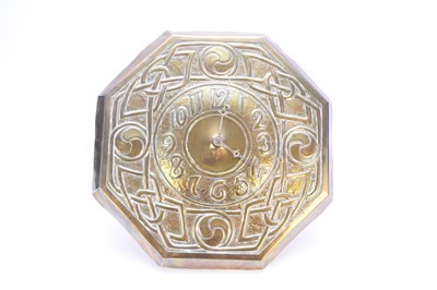 Lot 375 - An Arts & Crafts style stamped brass wall clock