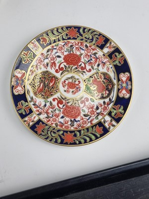 Lot 214 - A group of Royal Crown Derby Imari plates and a bowl