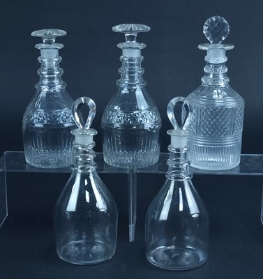 Lot 213 - A group of five George III glass decanters and stoppers