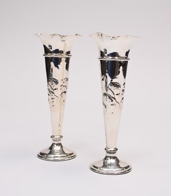 Lot 36 - A pair of Edwardian silver mounted vases