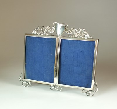 Lot 24 - A silver plated double photograph frame