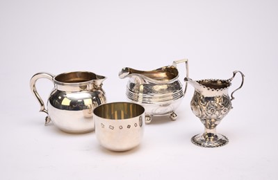 Lot 37 - Three silver jugs and a silver tumbler cup