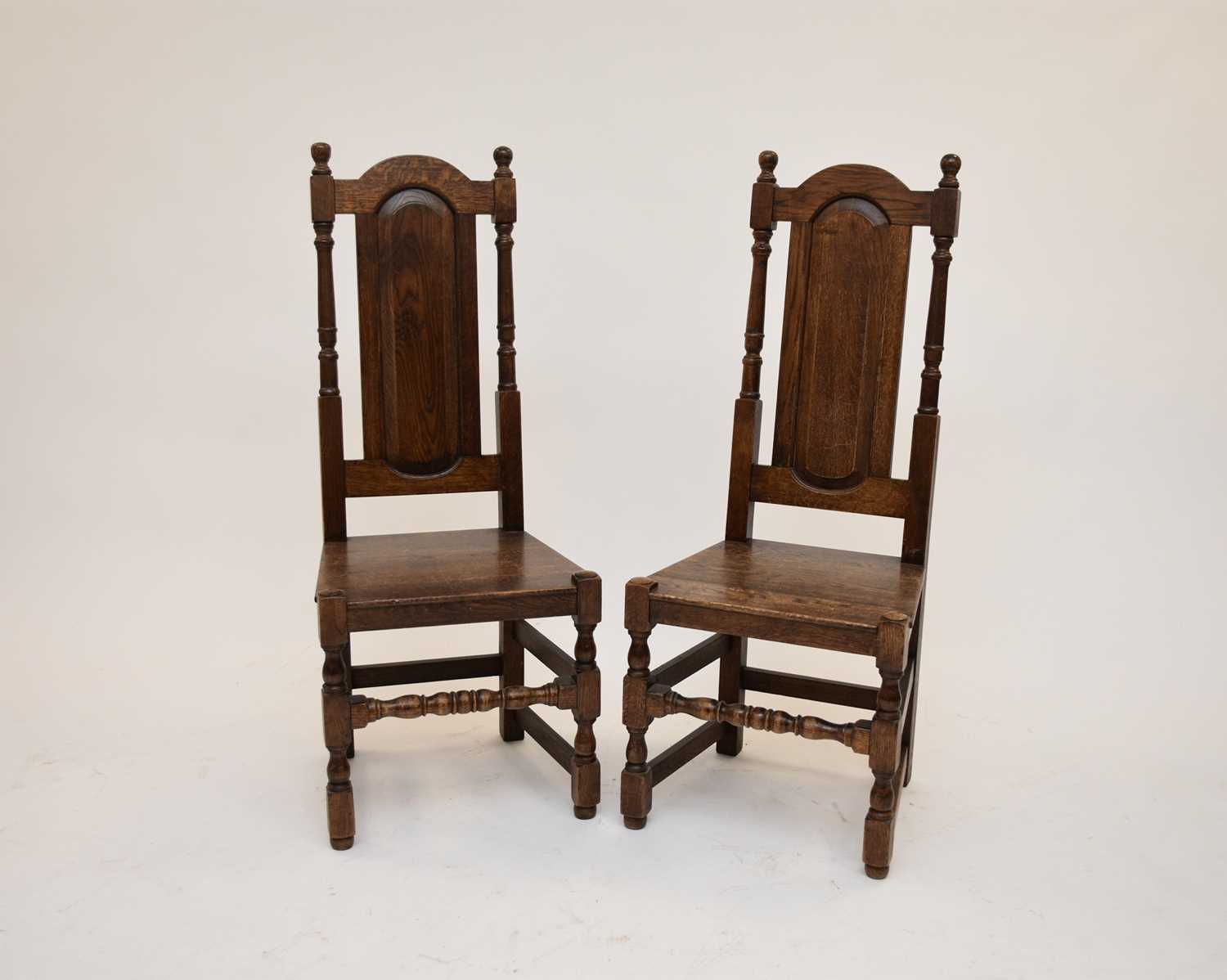 Lot 586 - A set of six William and Mary style oak panel-back dining chairs