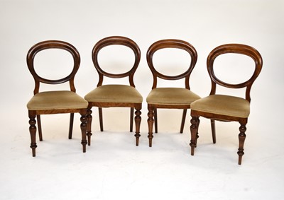 Lot 553 - A set of twelve mahogany balloon back dining chairs
