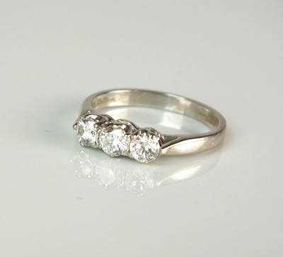 Lot 66 - An 18ct white gold three stone diamond ring